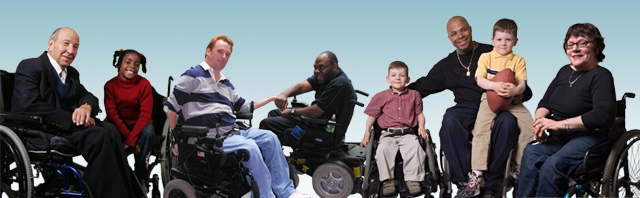 An image of National Spinal Cord Injury members. The members are all wheelchair users and are lined up in horizontal row. Represented are male and female members ranging from young children to seniors.