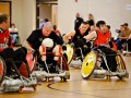 Quad rugby players roll down court in a game between the Raleigh Sidewinders and the East Coast Cripplers.