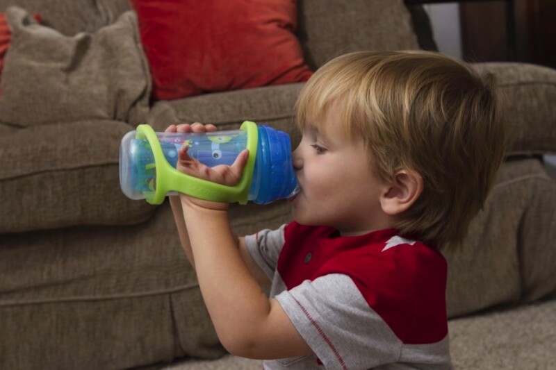 Boy using and EazyHolder with cup